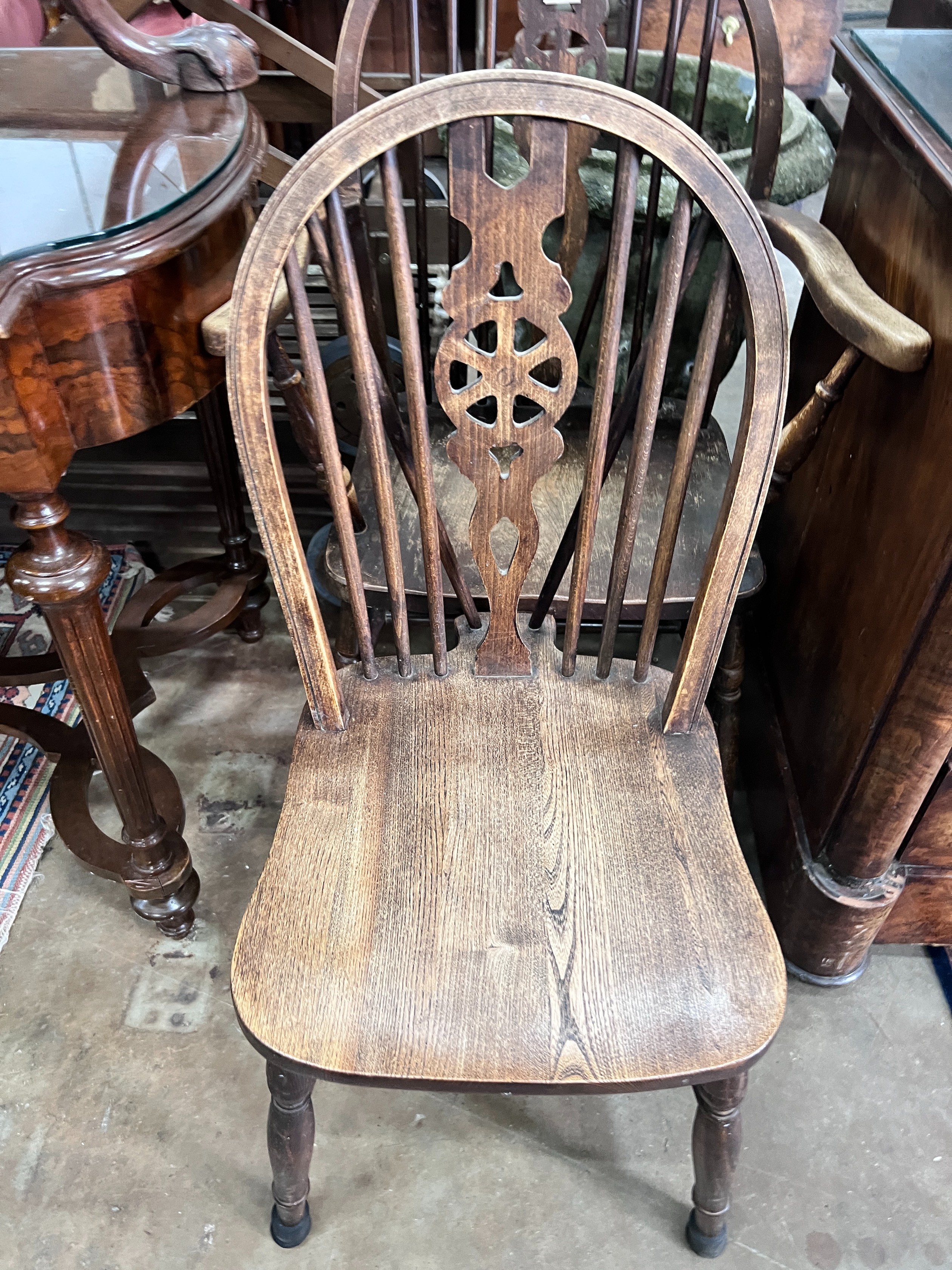 A George III style mahogany tripod table, diameter 49cm, height 60cm, and two wheelback chairs *Please note the sale commences at 9am.